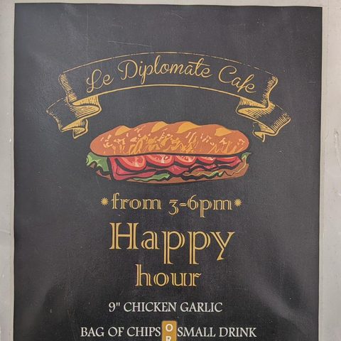Le Diplomate Cafe Happy Hour sign